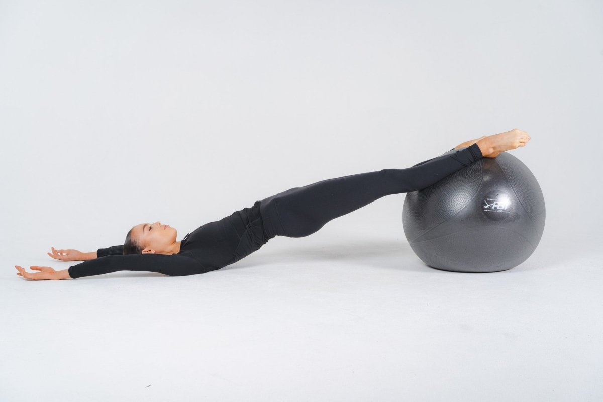 Pilates-inspired core workout with PBT ball for ballet dancers